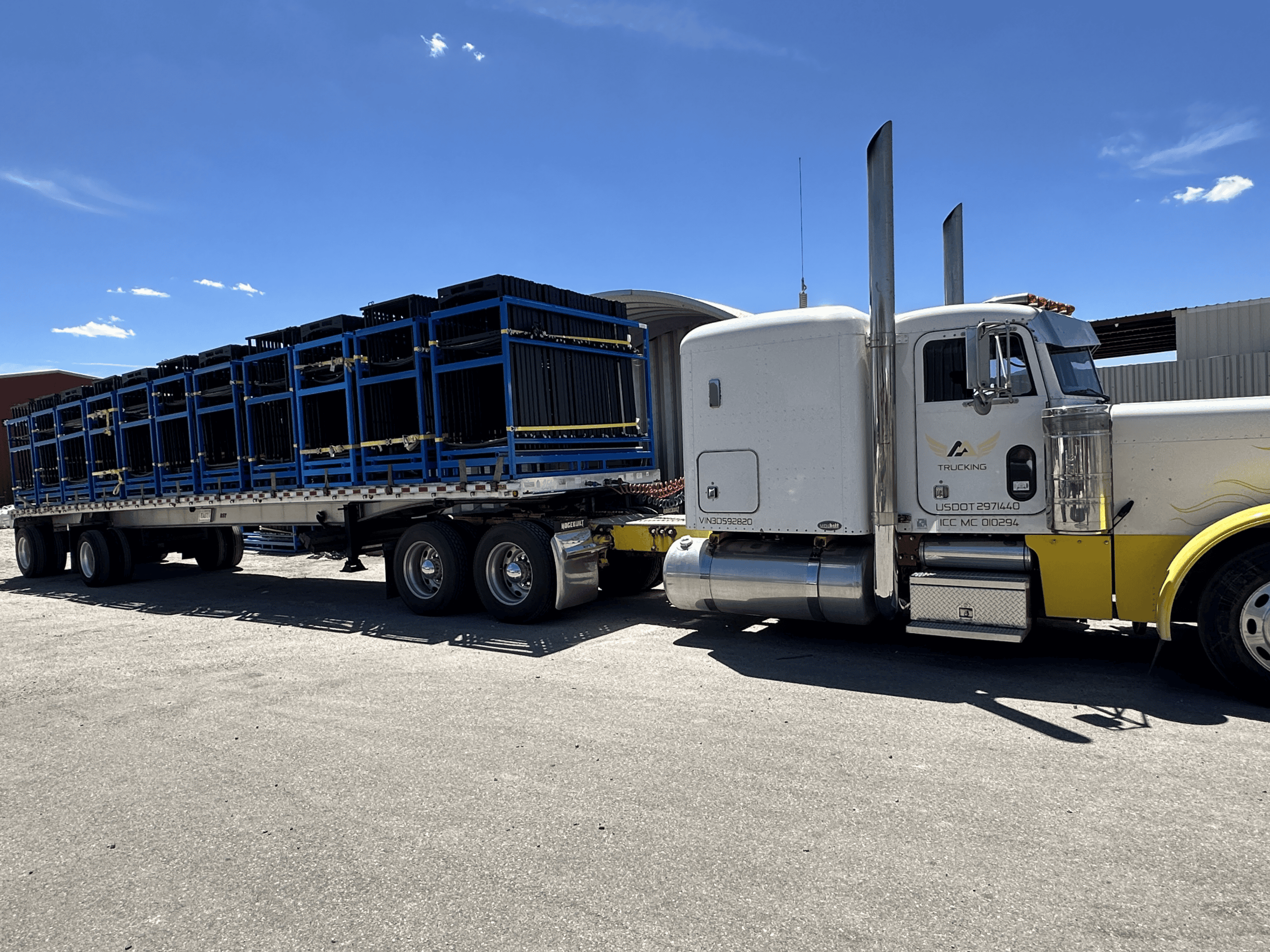 Large production components staged for shipment Semi truck loaded with powder-coated structural components for shipment